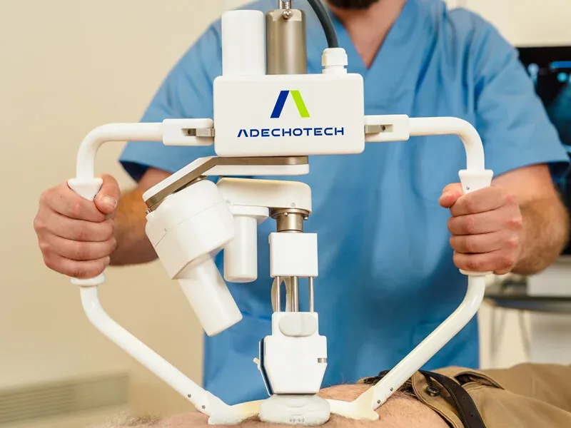 The MELODY robotic arm placed on a patient by a healthcare professional
